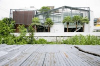 a house with a metal roof and a wooden deck
